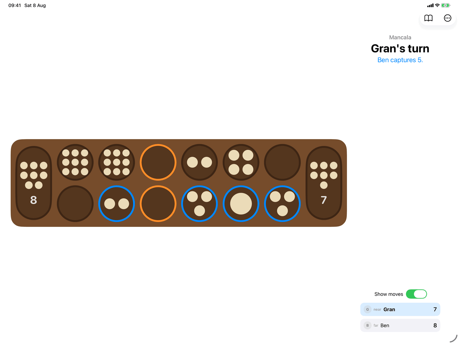 Mancala in Group Games, mid-game on an iPad host