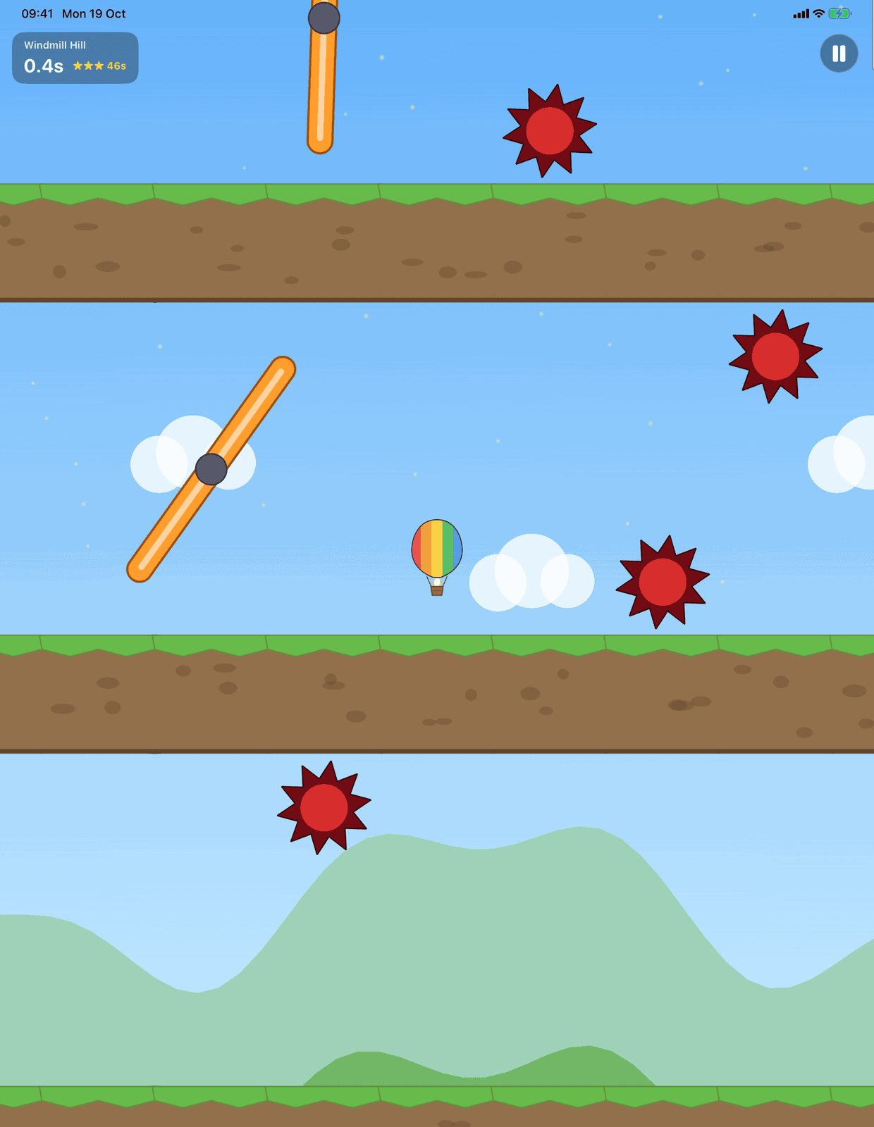 Looney Ballooney on iPad: the balloon rising between spinning paddles and spikes in Sunny Meadows